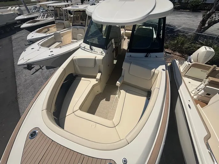  Yacht Photos Pics 2025 Chris-Craft Calypso 32 boat with spacious seating and elegant design.