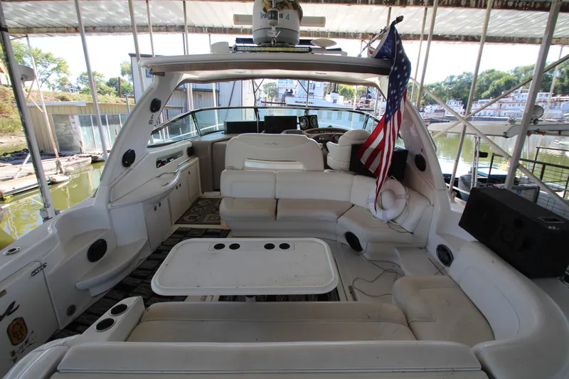  Yacht Photos Pics Interior of 2001 Sea Ray 460 Sundancer yacht with seating and American flag.