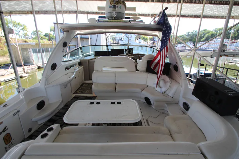  Yacht Photos Pics 2001 Sea Ray 460 Sundancer yacht interior with seating and American flag.