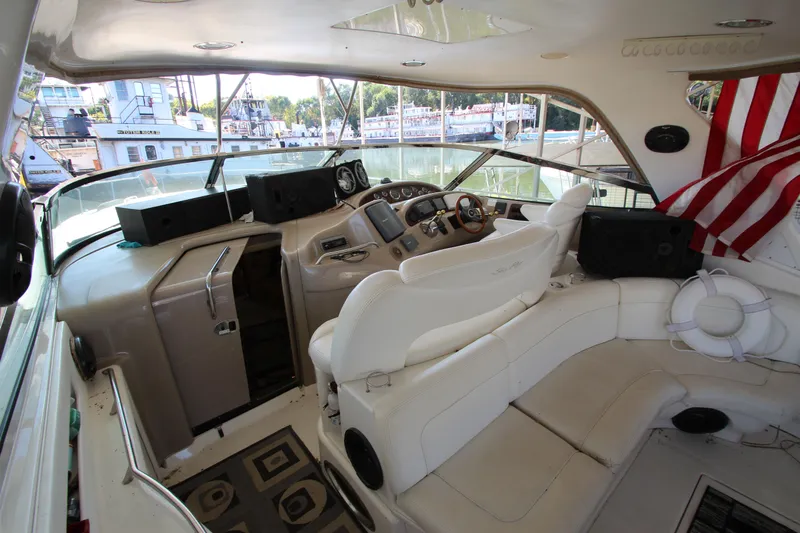  Yacht Photos Pics Interior of 2001 Sea Ray 460 Sundancer yacht with helm and seating area.