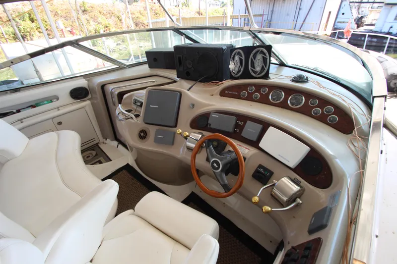  Yacht Photos Pics Interior helm of 2001 Sea Ray 460 Sundancer yacht with steering wheel and control panels.