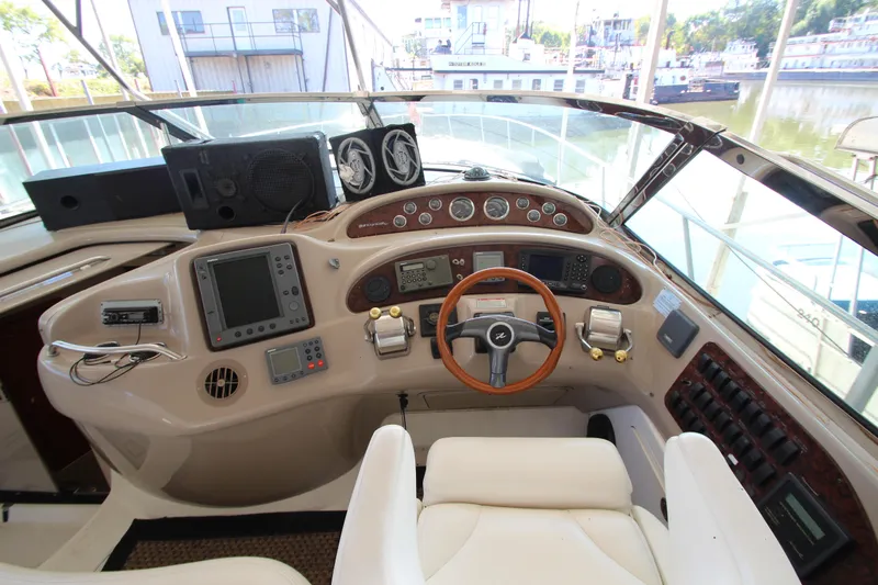  Yacht Photos Pics Helm of 2001 Sea Ray 460 Sundancer yacht with navigation instruments and steering wheel.
