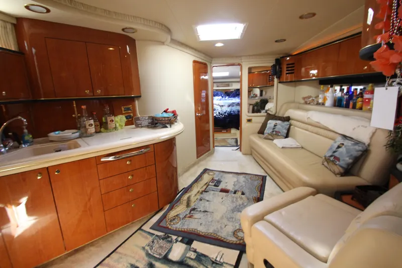  Yacht Photos Pics Luxurious interior of 2001 Sea Ray 460 Sundancer yacht with elegant wood cabinetry.