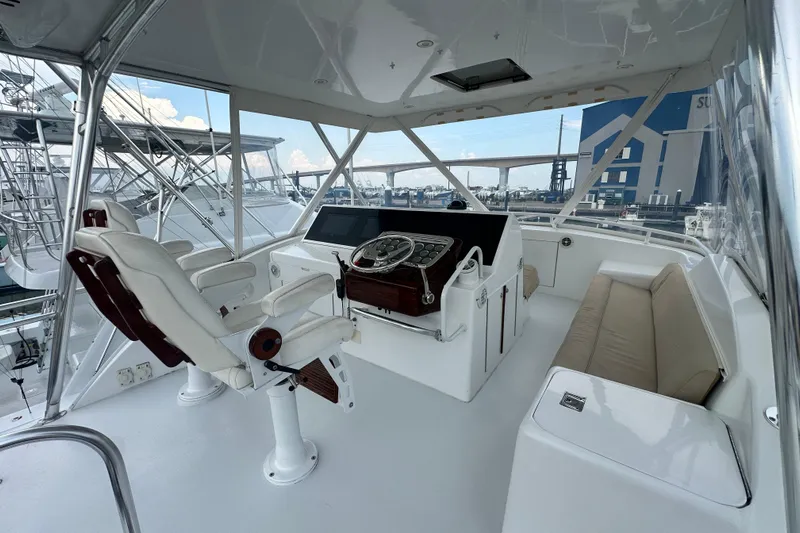 Loca Louise Yacht Photos Pics 2002 Hatteras 50 Convertible Sportfish helm with luxurious seating and modern controls.