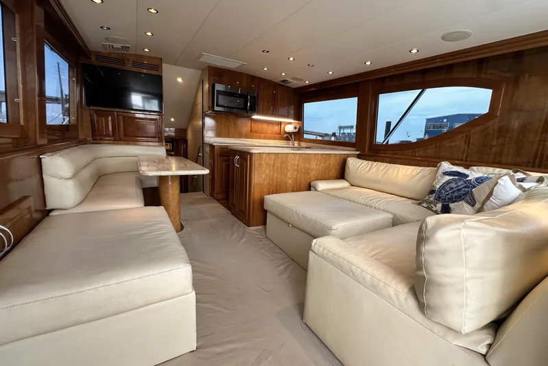 Loca Louise Yacht Photos Pics Luxurious interior of 2002 Hatteras 50 Convertible Sportfish with plush seating and modern amenities.