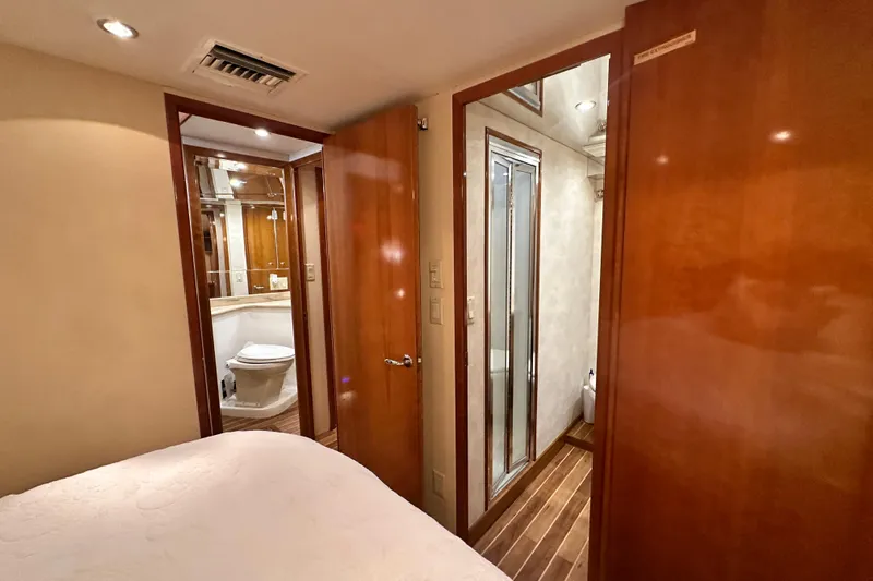 Loca Louise Yacht Photos Pics 2002 Hatteras 50 Convertible Sportfish interior with bathroom and wooden finishes.