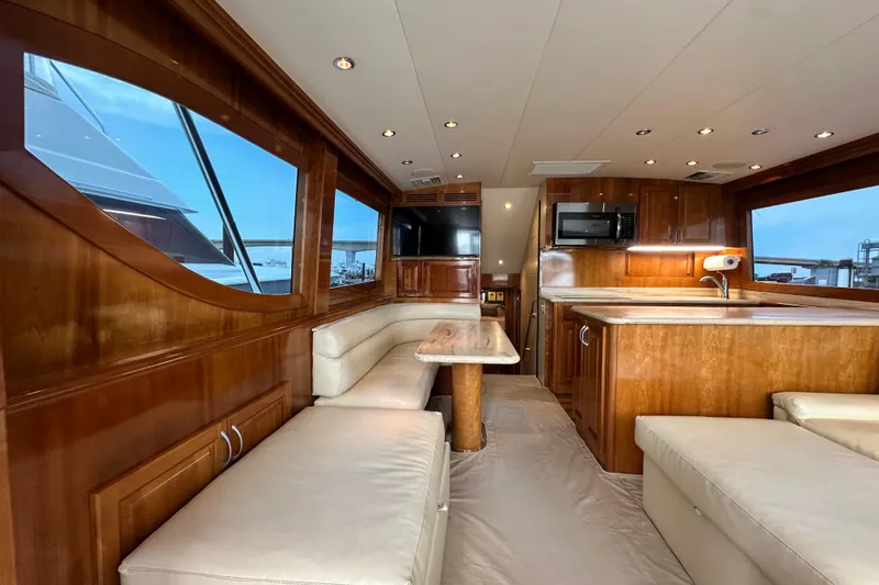 Loca Louise Yacht Photos Pics Luxurious interior of 2002 Hatteras 50 Convertible Sportfish yacht with wood finishes and modern amenities.