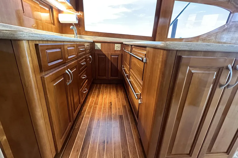 Loca Louise Yacht Photos Pics Luxurious wooden interior of 2002 Hatteras 50 Convertible Sportfish yacht kitchen.