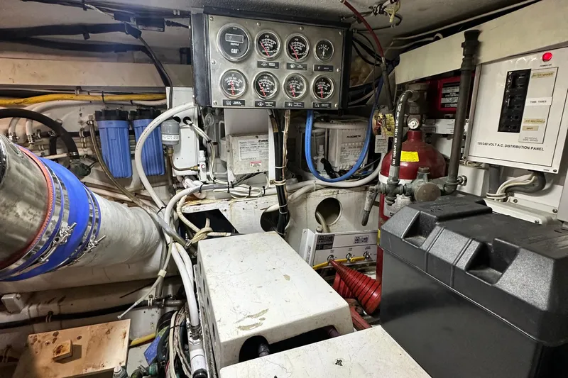 Loca Louise Yacht Photos Pics Engine room of 2002 Hatteras 50 Convertible Sportfish with gauges and wiring.