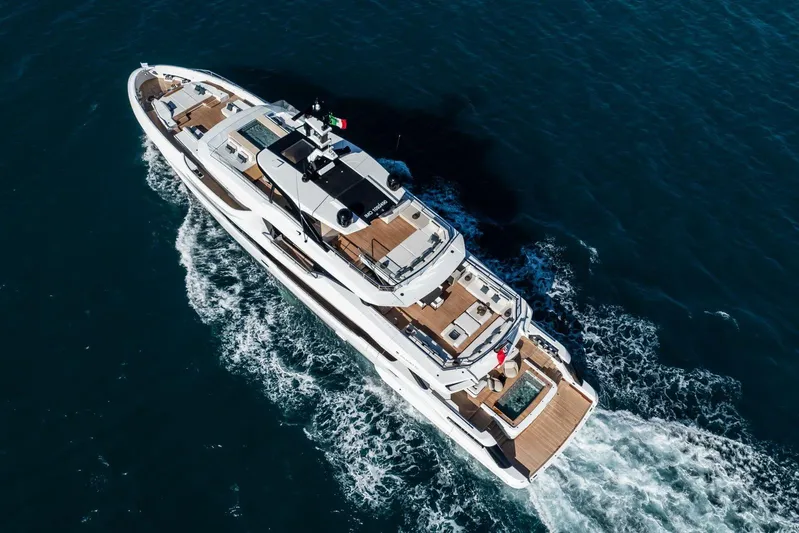  Yacht Photos Pics Aerial view of 2025 Baglietto DOM 133 yacht cruising on the ocean.