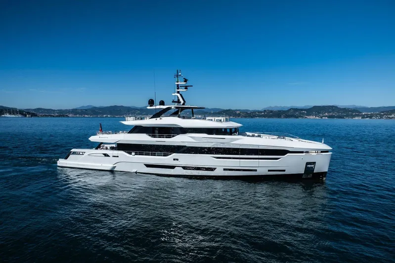  Yacht Photos Pics Luxurious 2025 Baglietto DOM 133 yacht cruising on serene blue waters.