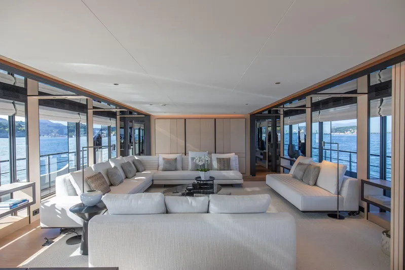  Yacht Photos Pics Luxurious interior of 2025 Baglietto DOM 133 yacht with elegant seating and panoramic windows.