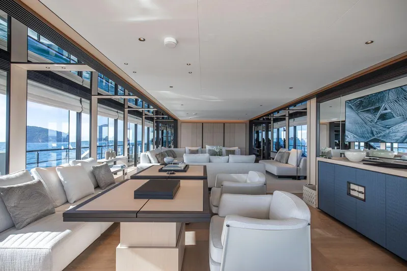  Yacht Photos Pics Luxurious interior of 2025 Baglietto DOM 133 yacht with modern furnishings and ocean view.