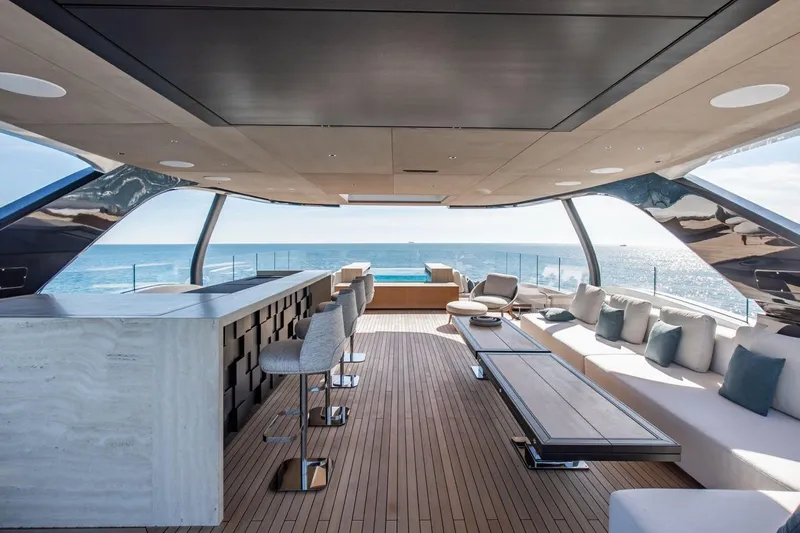  Yacht Photos Pics Luxurious interior of 2025 Baglietto DOM 133 yacht with ocean view and modern furnishings.