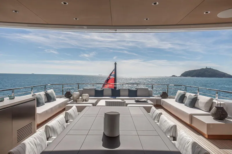  Yacht Photos Pics Luxurious Baglietto DOM 133 yacht deck with ocean view, elegant seating, and modern design, 2025 model.