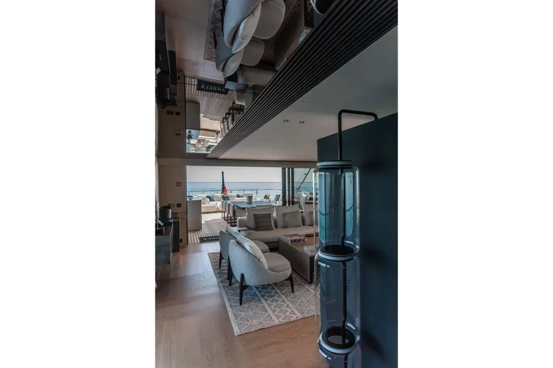  Yacht Photos Pics Luxurious interior of 2025 Baglietto DOM 133 yacht with modern furnishings and ocean view.