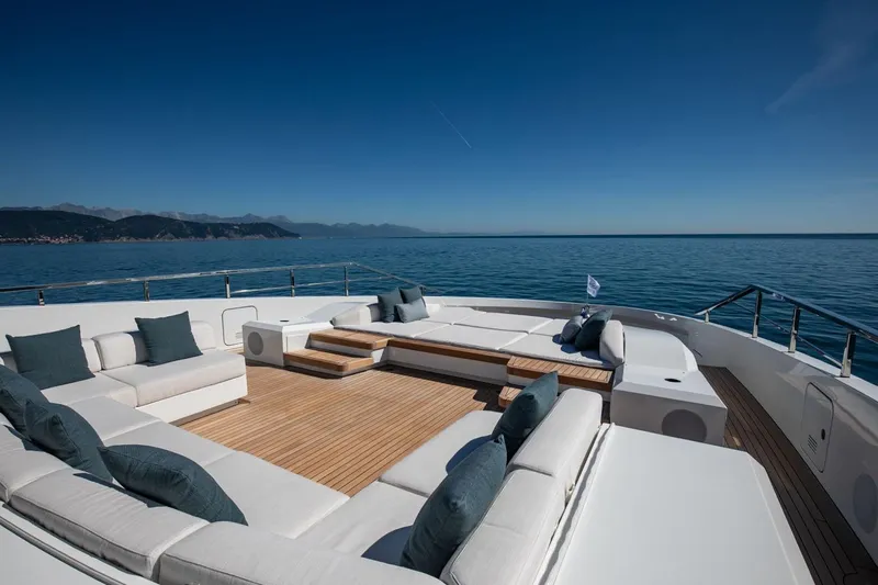  Yacht Photos Pics Luxurious 2025 Baglietto DOM 133 yacht deck with elegant seating and ocean view.