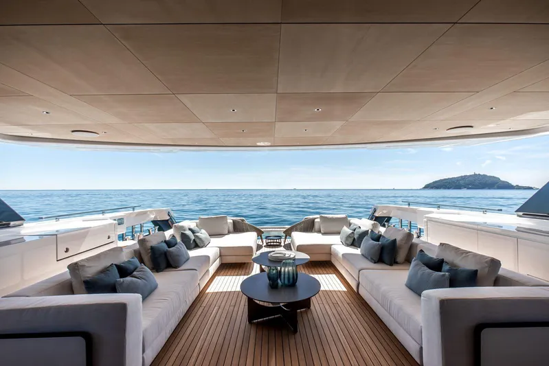  Yacht Photos Pics Luxurious 2025 Baglietto DOM 133 yacht deck with elegant seating and ocean view.
