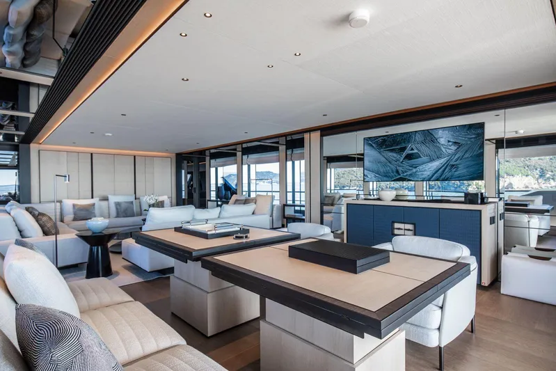  Yacht Photos Pics Luxurious interior of 2025 Baglietto DOM 133 yacht with modern furnishings and large TV.