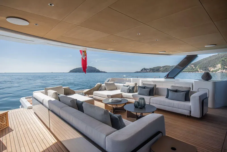  Yacht Photos Pics Luxurious 2025 Baglietto DOM 133 yacht deck with elegant seating and ocean view.