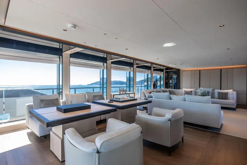  Yacht Photos Pics Luxurious interior of 2025 Baglietto DOM 133 yacht with ocean view and modern furnishings.