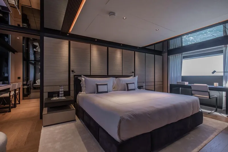  Yacht Photos Pics Luxurious bedroom interior on 2025 Baglietto DOM 133 yacht, featuring modern design and elegant furnishings.