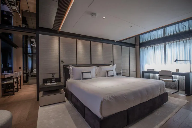  Yacht Photos Pics Luxurious bedroom interior on Baglietto DOM 133 yacht, 2025 model, featuring modern design and elegant furnishings.