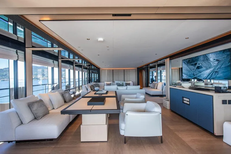  Yacht Photos Pics Luxurious interior of 2025 Baglietto DOM 133 yacht with modern furnishings and panoramic windows.