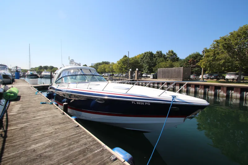  Yacht Photos Pics 2012 Formula 400 Super Sport boat docked at a marina on a sunny day.