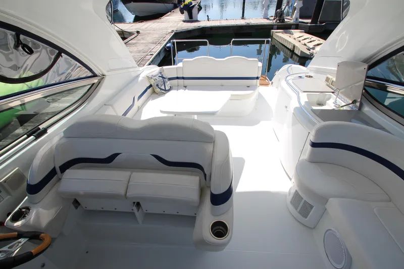  Yacht Photos Pics 2012 Formula 400 Super Sport boat interior with white seating and dock view.