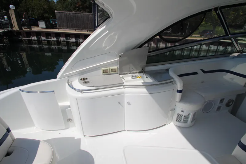  Yacht Photos Pics 2012 Formula 400 Super Sport boat interior with kitchenette and seating area.