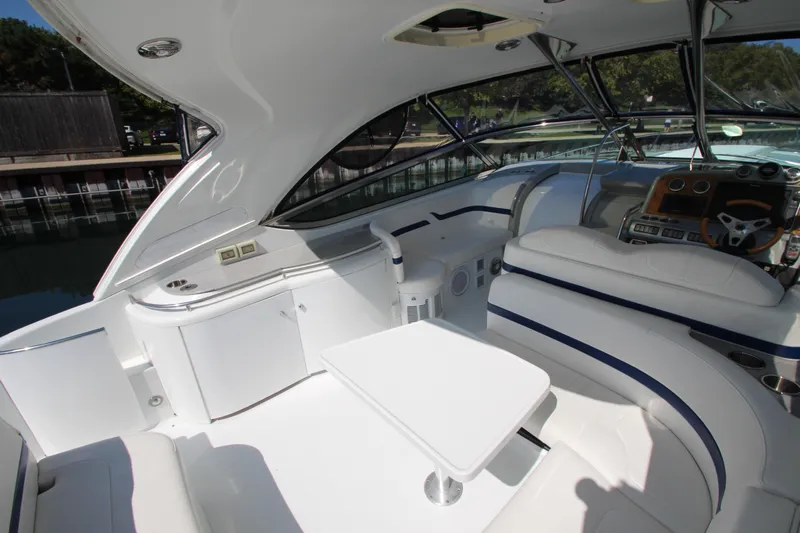  Yacht Photos Pics Interior of a 2012 Formula 400 Super Sport boat with white seating and table.
