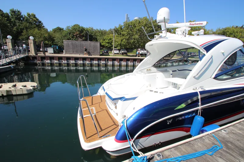  Yacht Photos Pics 2012 Formula 400 Super Sport yacht docked at a marina on a sunny day.