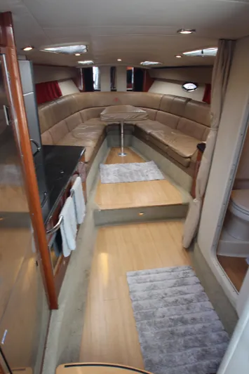  Yacht Photos Pics Interior of a 2012 Formula 400 Super Sport yacht with beige seating and wooden flooring.