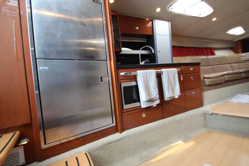  Yacht Photos Pics 2012 Formula 400 Super Sport yacht interior kitchen with stainless steel appliances.