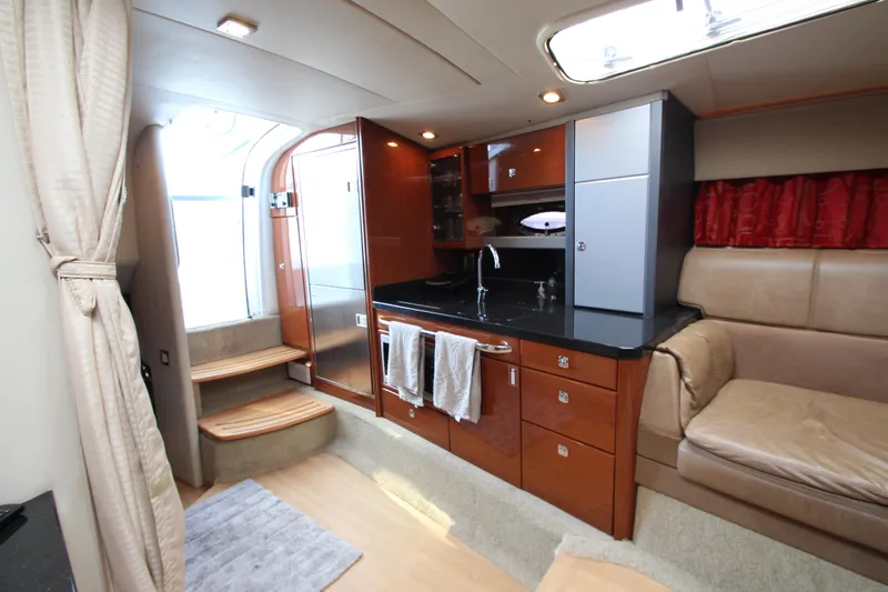  Yacht Photos Pics Interior of a 2012 Formula 400 Super Sport yacht with modern kitchen and seating area.