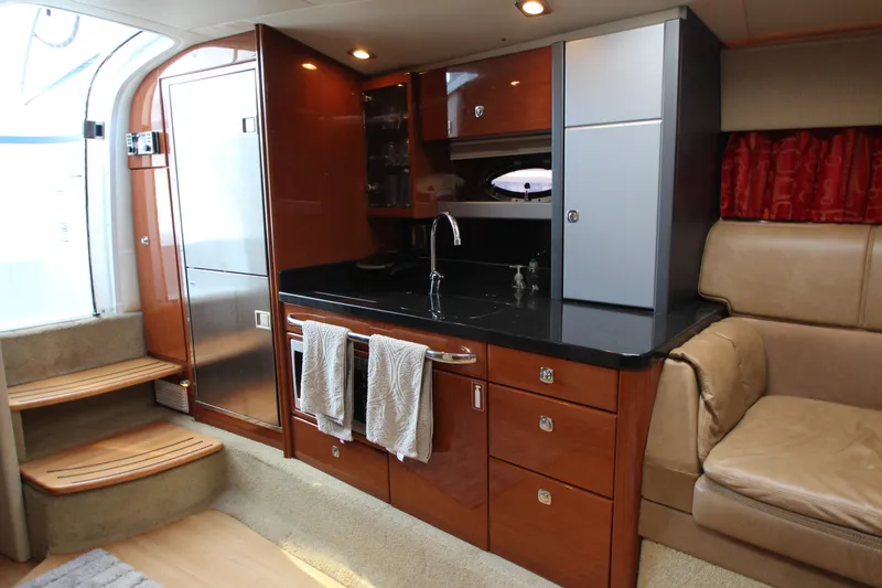  Yacht Photos Pics Interior of a 2012 Formula 400 Super Sport yacht with modern kitchen amenities.
