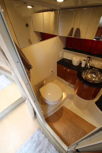  Yacht Photos Pics 2012 Formula 400 Super Sport yacht bathroom with modern fixtures and wooden accents.