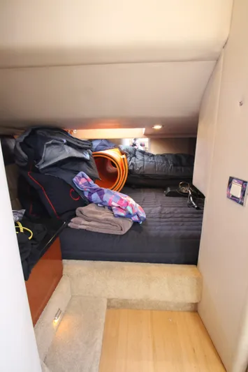  Yacht Photos Pics 2012 Formula 400 Super Sport cabin with storage and bedding.