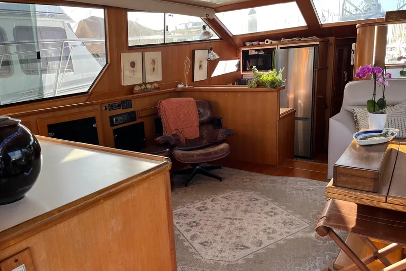  Yacht Photos Pics Interior of 1990 Mikelson 48 Sportfisher yacht with cozy seating and elegant decor.