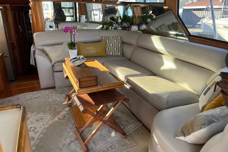  Yacht Photos Pics Luxurious interior of 1990 Mikelson 48 Sportfisher with plush seating and elegant decor.