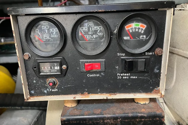  Yacht Photos Pics Control panel of a 1990 Mikelson 48 Sportfisher with gauges and switches.