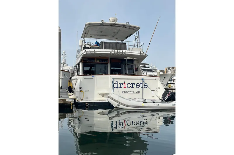  Yacht Photos Pics 1990 Mikelson 48 Sportfisher yacht docked, featuring "dricrete" branding from Phoenix, AZ.