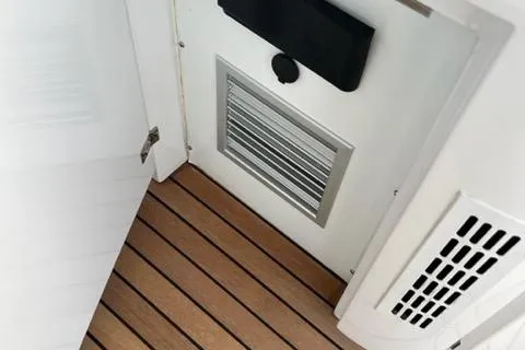  Yacht Photos Pics Interior view of 2011 Pershing 50.1 yacht with wooden flooring and ventilation panel.