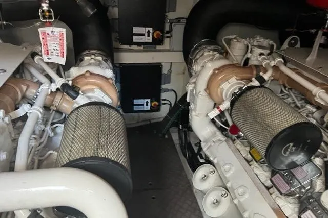  Yacht Photos Pics Engine room of a 2011 Pershing 50.1 yacht, showcasing dual engines and components.