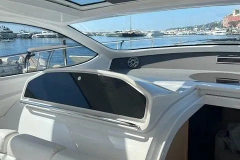  Yacht Photos Pics 2011 Pershing 50.1 yacht interior with marina view, featuring sleek design and modern amenities.