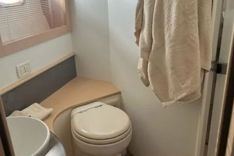  Yacht Photos Pics Bathroom interior of 2011 Pershing 50.1 yacht with towel and toilet.