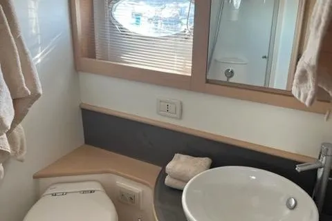  Yacht Photos Pics Bathroom interior of 2011 Pershing 50.1 yacht with modern fixtures and window.