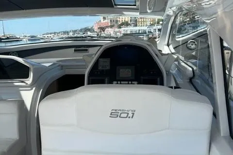  Yacht Photos Pics 2011 Pershing 50.1 yacht interior with helm, docked in a scenic marina.