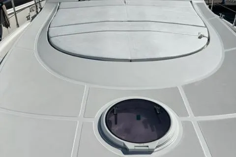  Yacht Photos Pics 2011 Pershing 50.1 yacht deck with circular hatch and sleek design.